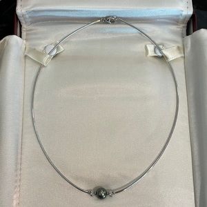 Mikimoto black pearl and diamond necklace.